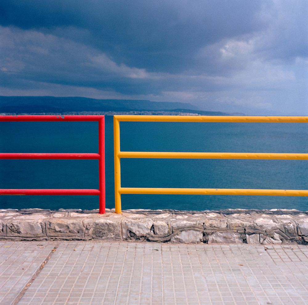 rails railings beaches coasts italy italian seawalls mediteranean water sky skies ***
