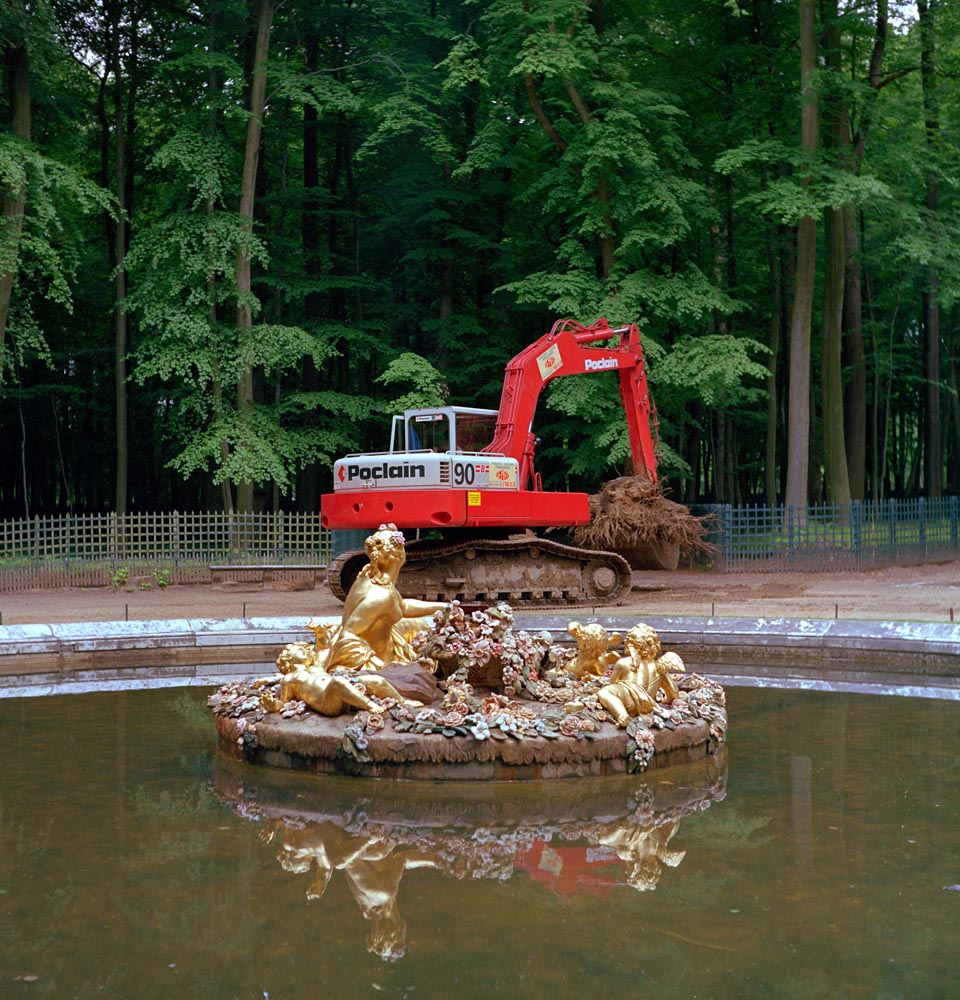 fountains shovels construction landscaping backhoe red gold water Versailles reflection surrealism green trees deconstruction bizarre nature