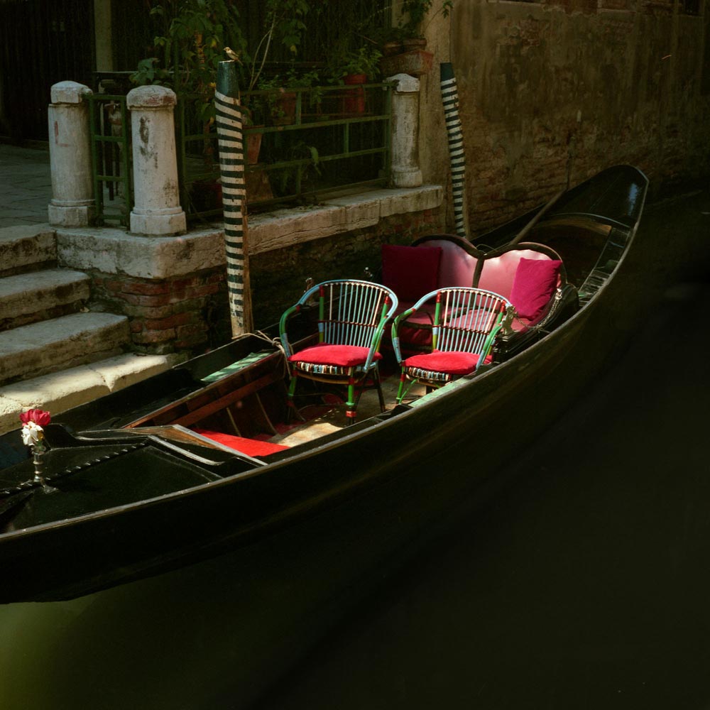 gondolas boats venice italy italian chairs boating Venice stripes dock water pillows red brown black white