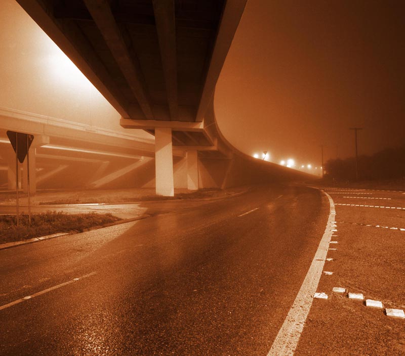 roads highways red nighttime darkness urban city streets overpass freeway interstate fog haze surrealism bizarre orange yellow glowing stripes lines black