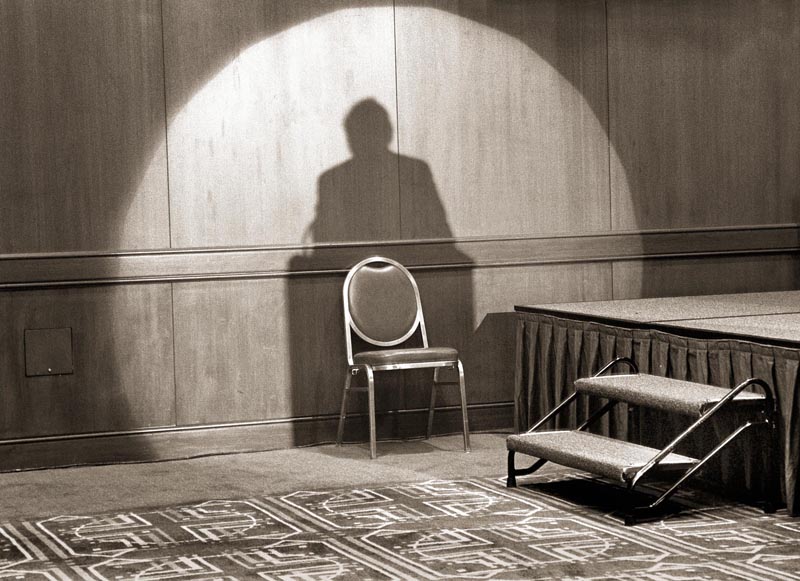 shadow spotlight chair silhouette stage black and white UFO gray grey sitting stairs wall circle surrealism