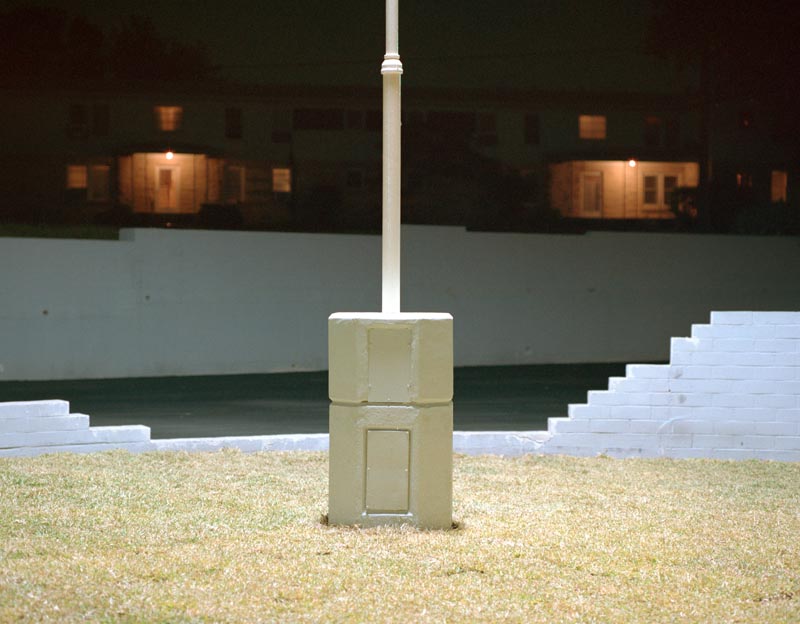 light windows night smile stairs pole cement orange glow bricks white grass surrealism